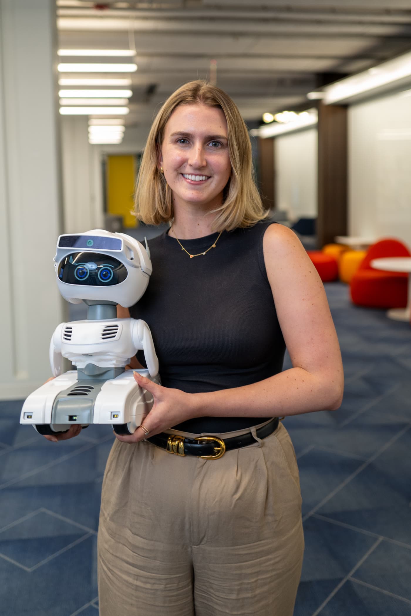 Tess Flanagan holding a Misty robot